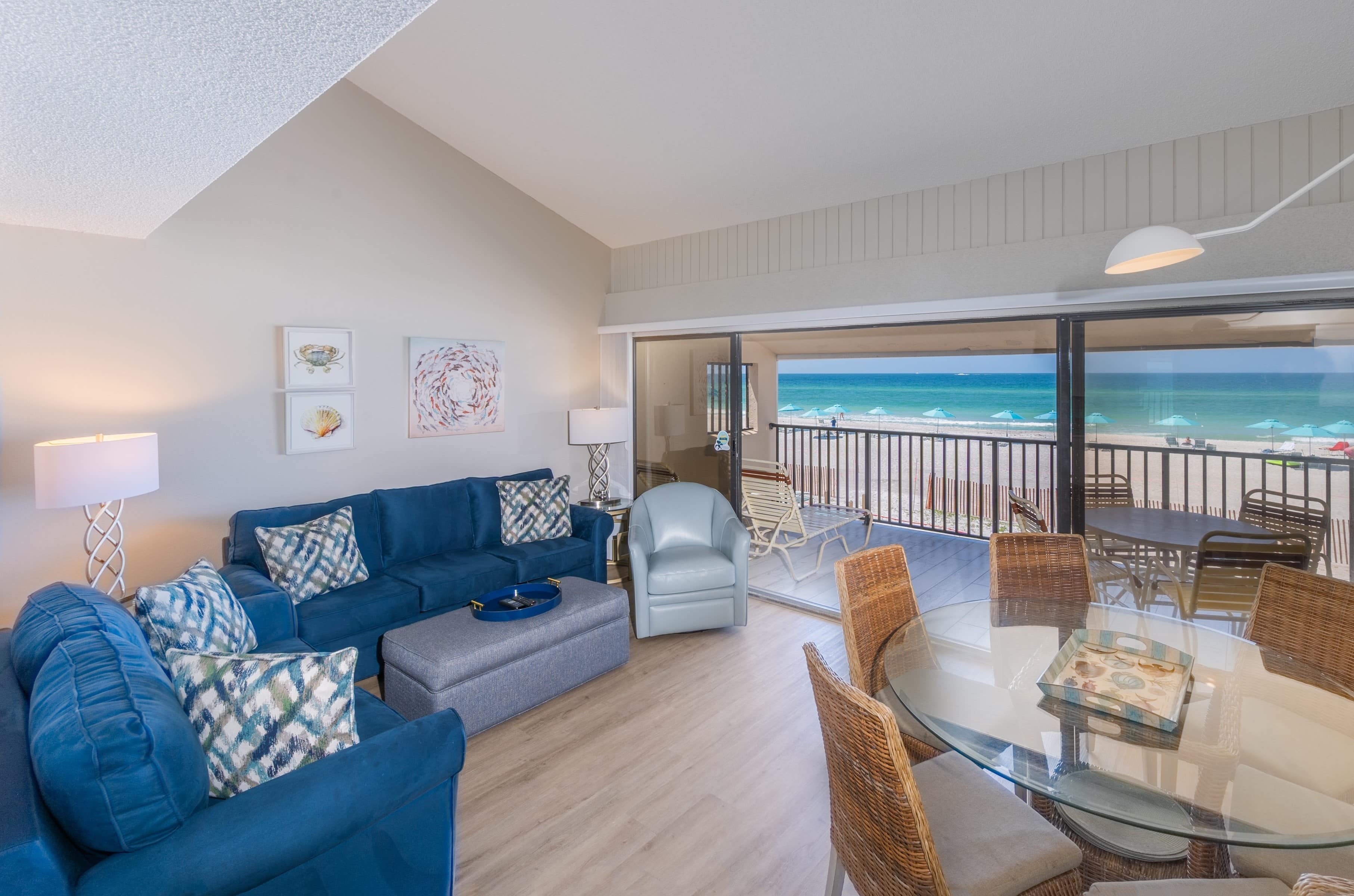 Casa Del Mar rental interior with blue seating and Gulf view